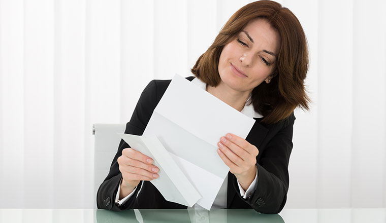 A person reading a letter