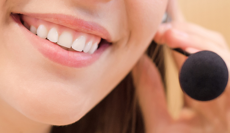 Smiling person in headset