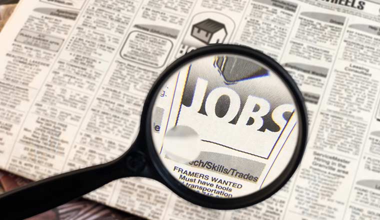 Newspaper with the words job search