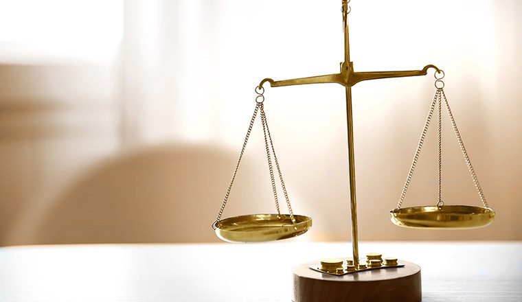 A photo of a traditional gold balance