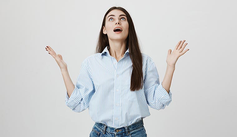Person looking shocked at the ceiling