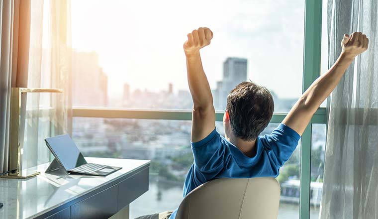 A photo of someone celebrating in an office chair