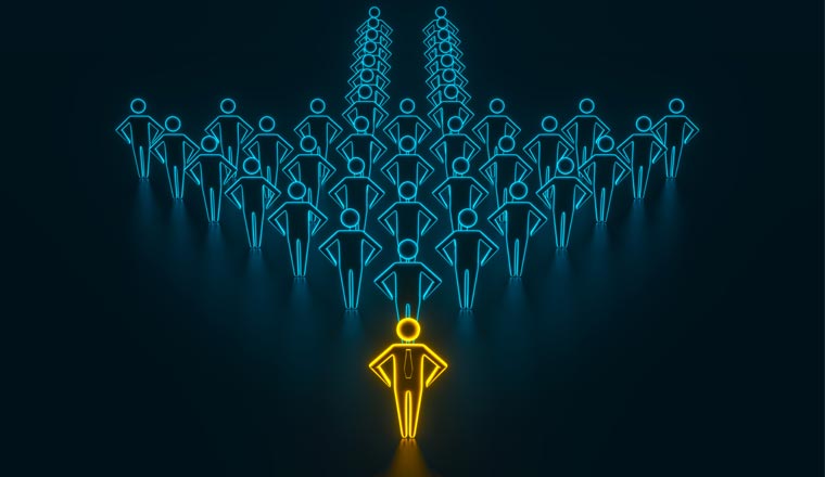 A picture of a business team with a gold leader