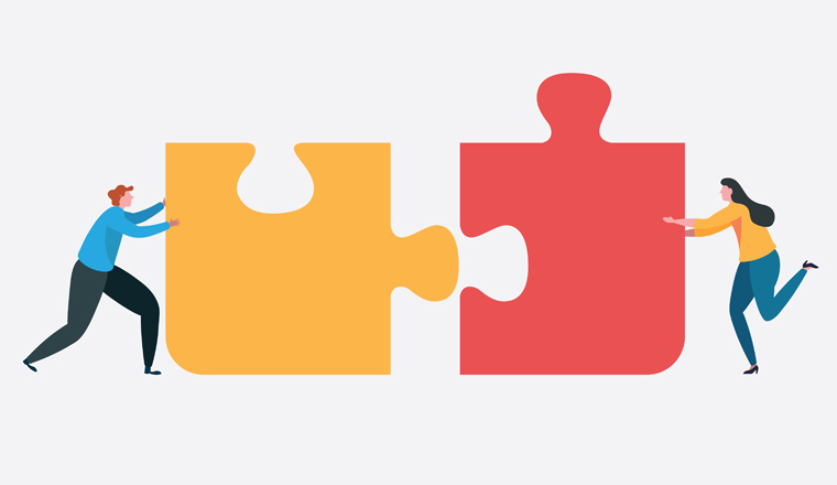 A picture of two puzzle pieces joining together