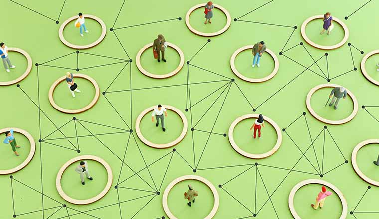 people figures over wooden table