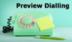 Green retro telephone with sticky note and pen with and words preview dialling
