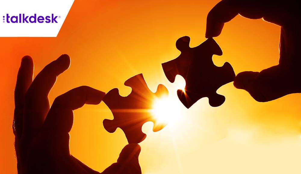 Partnership concept with two hands joining puzzle pieces