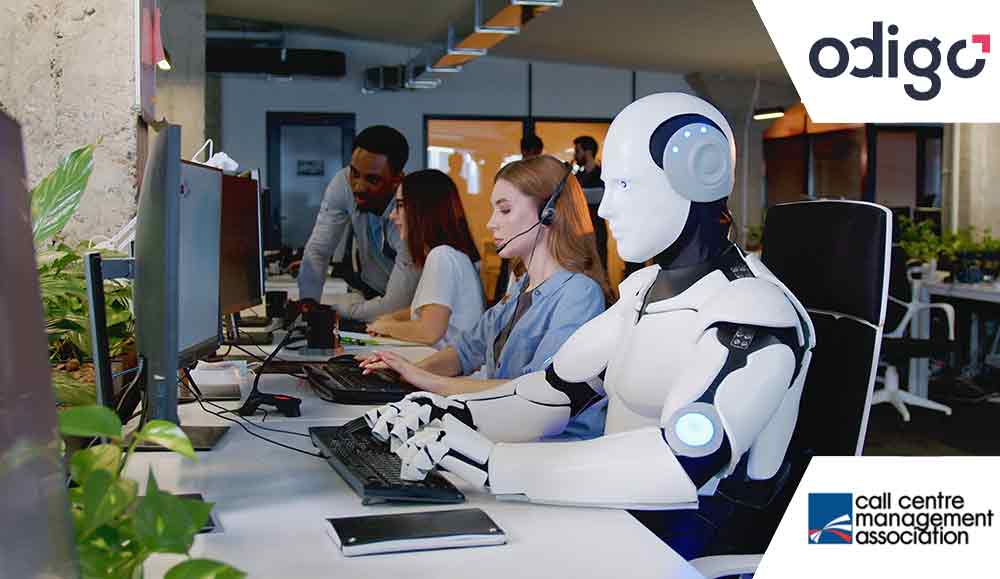 Robot working at computer among people