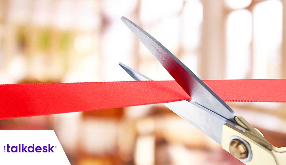 Unveil concept with scissors cutting ribbon