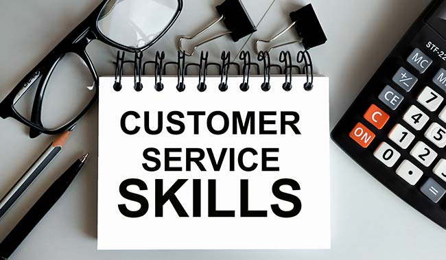 Customer Service Skills written on a notepad