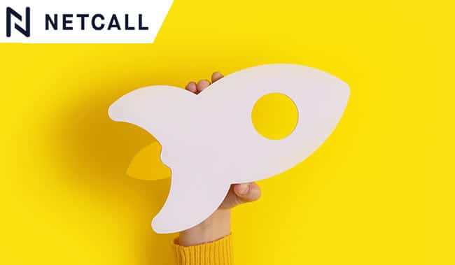 hand holding rocket over trendy yellow background