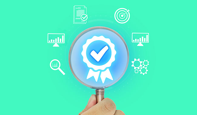 quality icon inside magnifying glass with data symbols around the outside