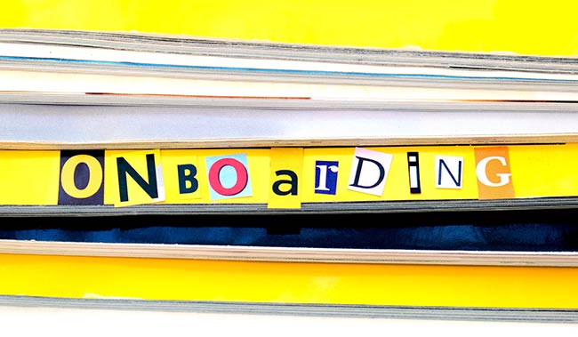 The word onboarding on the side a book