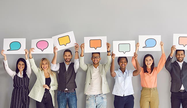 People holding up speech bubble