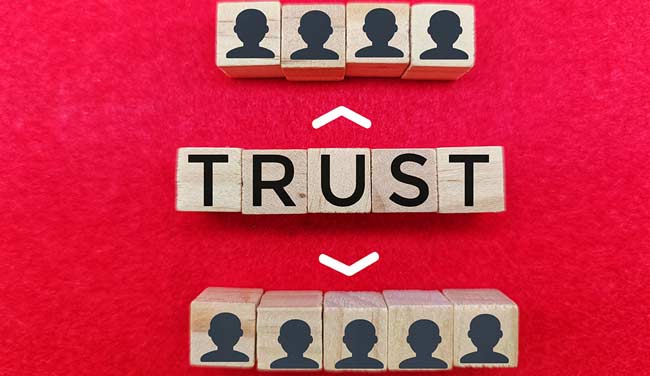 Wooden Blocks Spelling Trust with people blocks - building customer trust concept