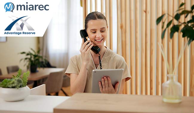 Women on a phone call holiday a tablet