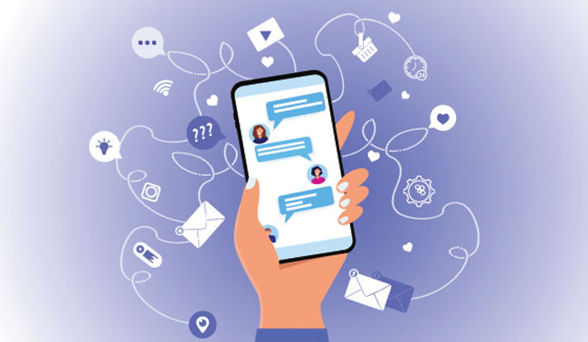 A hand holds a phone with an open chat