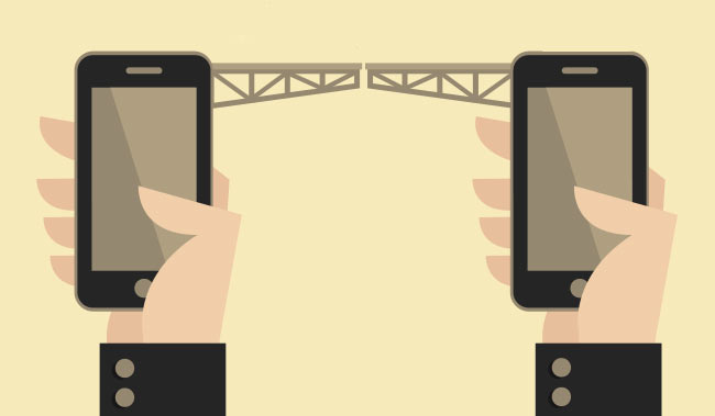 2 hands holding 2 phones with a train track connecting them together