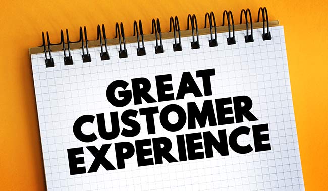 The word Great Customer Experience on a notepad