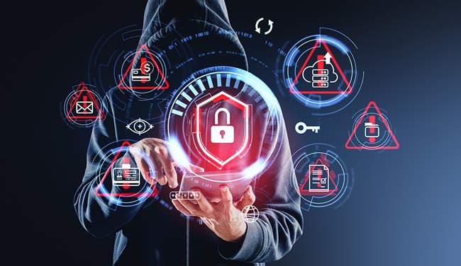 Person in hoodie using a tablet with digital lock icons and warning signs