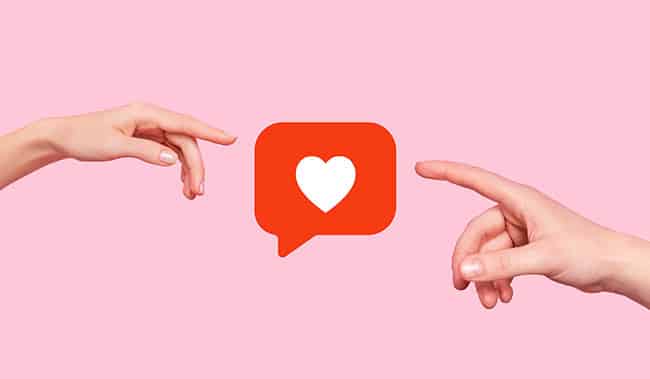 2 hands pointing at a love heart