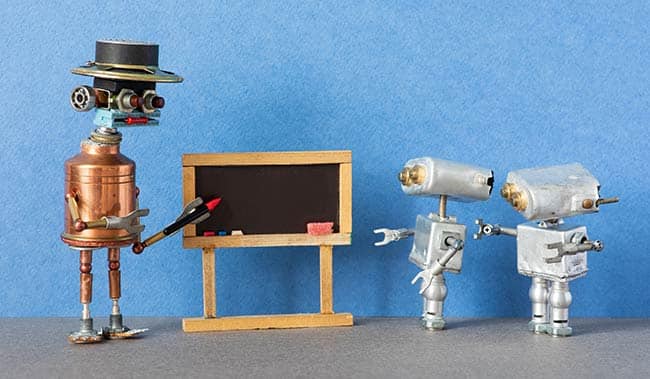 Robot holding pen up to whiteboard - AI coaching concept