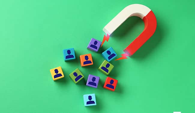Magnet attracting blocks with people figures on them