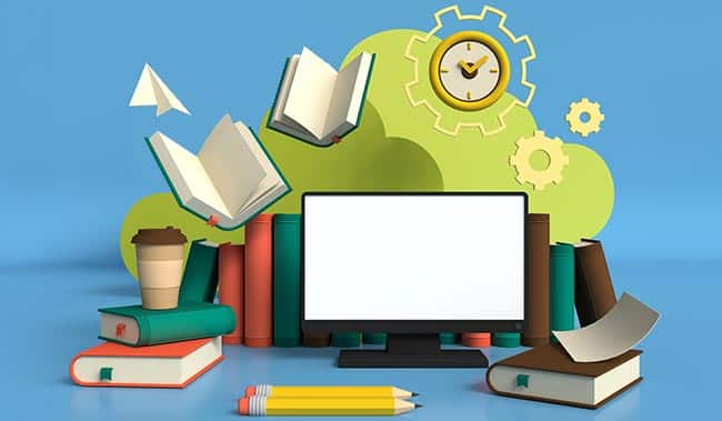 Computer surrounded by books