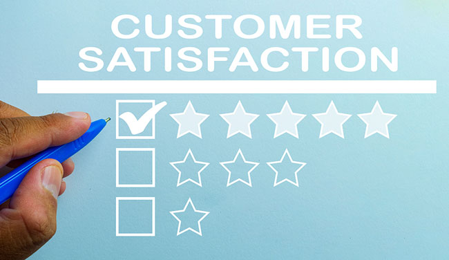 Hand putting check mark a checkbox on five star rating