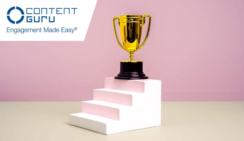 Gold trophy on top of white steps