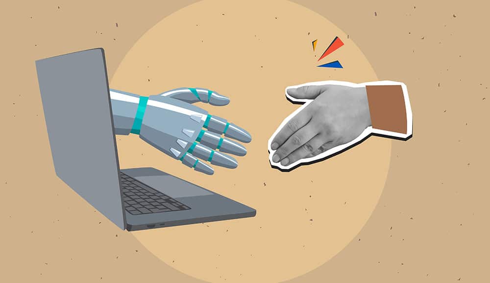 A robotic hand extending from a laptop screen and a human hand ready for handshake