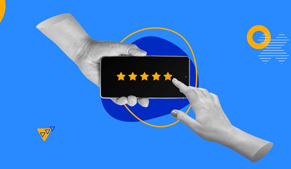 Hand pointing at a phone with 5 stars on it
