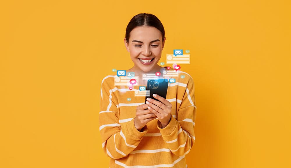 Happy woman using mobile phone to use self service on orange background with icons around it